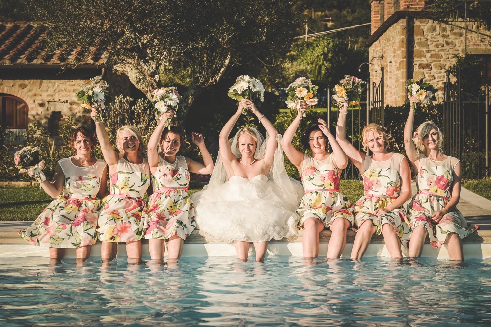 Pool Wedding Ideas. Funny moment by the pool, bride and bridesmaids.