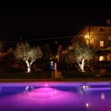 Exclusive weddings villa Italy, Pool at night time with inside the water coloured lighting effect.