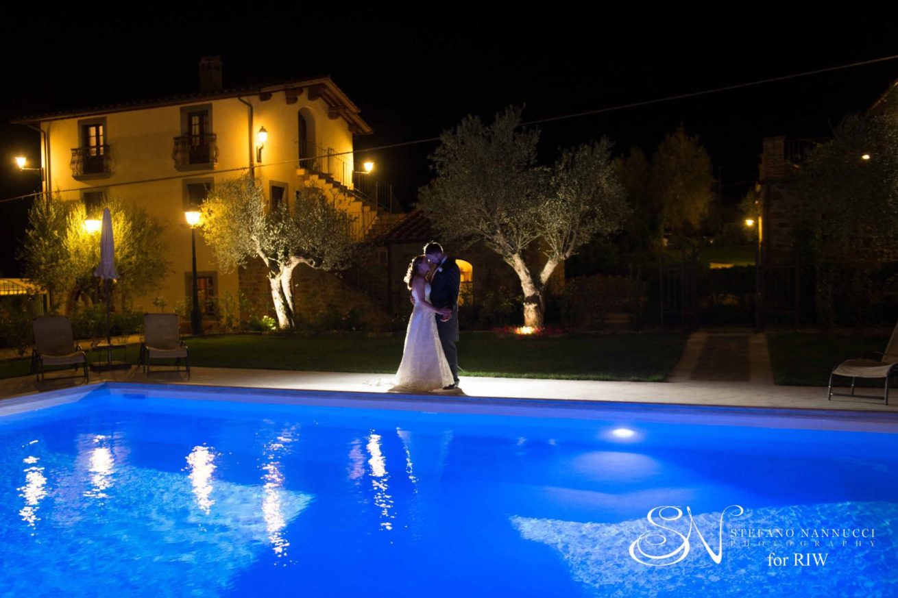 Exclusive weddings villa Italy, beautiful photo at Pool area at night time with inside the water coloured lighting effect. Outdoor Wedding Villa Italy. Pool Wedding ideas